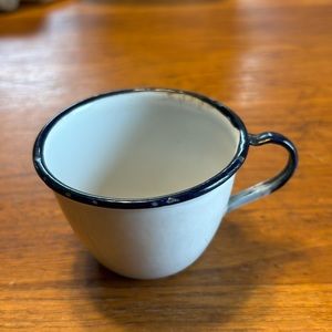 Vintage child white with black trim enamelware drinking cup with handle